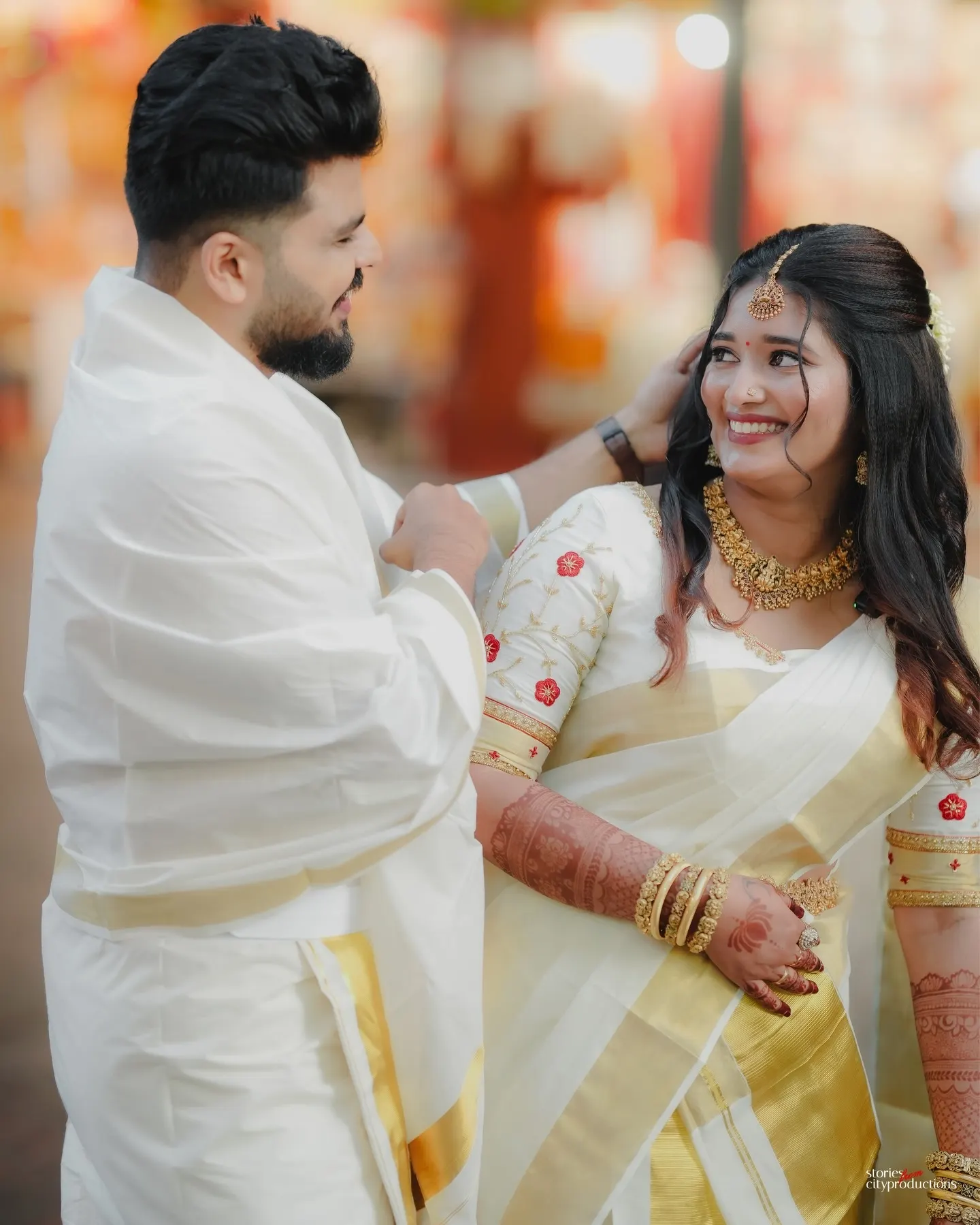 Kerala bride and groom smiling at one another