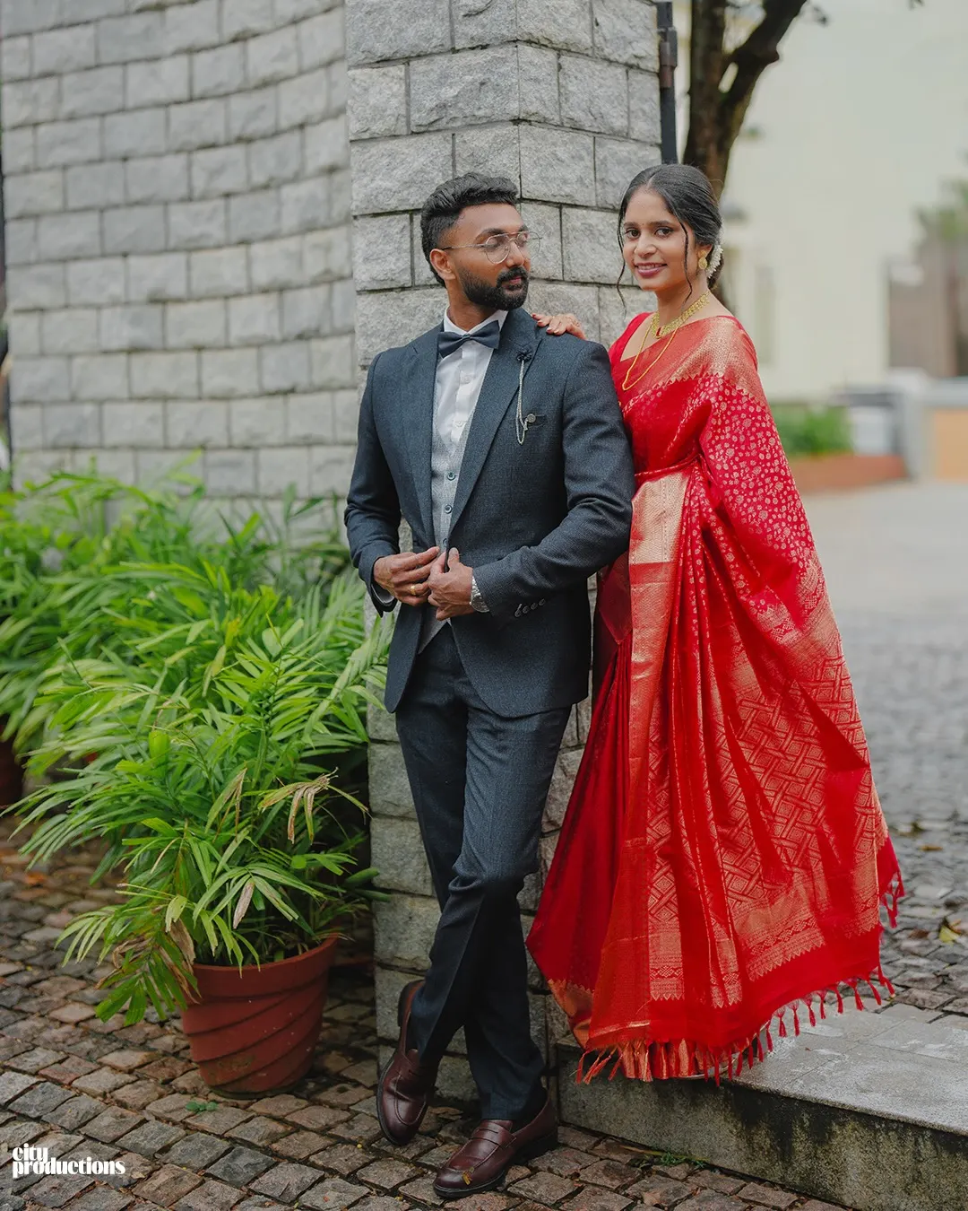 Bride and groom posing in formal wedding attire